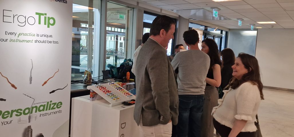Dental professionals at the ErgoDenta booth in the Netherlands